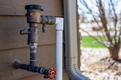 A backflow preventer (left) and check valve (right).