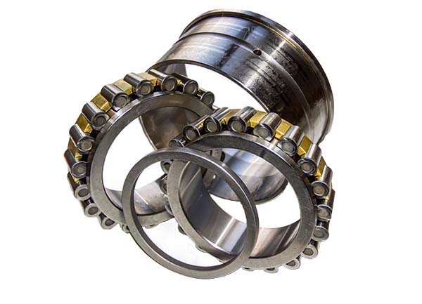 Spacer-assembled tapered roller bearing