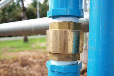 A backflow preventer (left) and check valve (right).