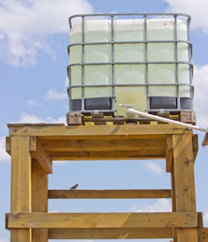 An elevated water tank for an off-grid system