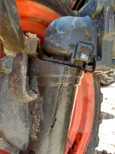 Hydraulic fluid leaking from a front wheel assemblage