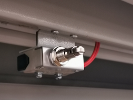 A limit switch installed to operate when a closet door is opened or closed.