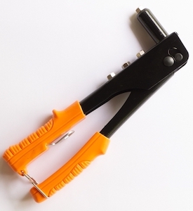 A heavy-duty lever riveter (left top), standard rivet gun (left bottom), lazy tong riveter (middle), and long nose riveter (right).