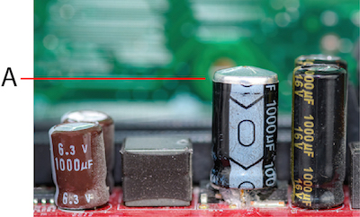 Capacitor with a bulging top vent