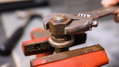 Secure the threaded piece (bolt or nut) so it will not move during the filing process.