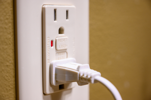 An outlet with a ground fault circuit interrupter